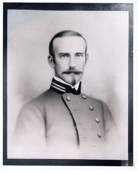 Portrait of Cadet S. B. Pickens, with mustache and goatee, in a gray high-collared uniform